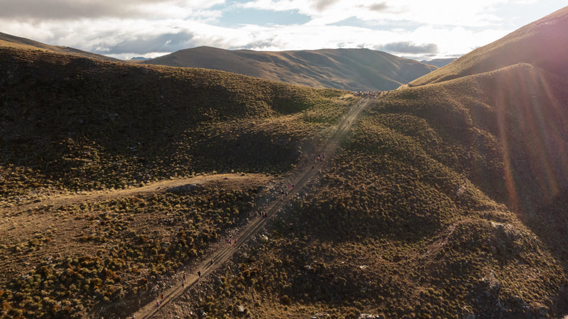 Drone shot of competitors climbing Breast Hill at the Hike for a Cure event at Lake Hawea Station.