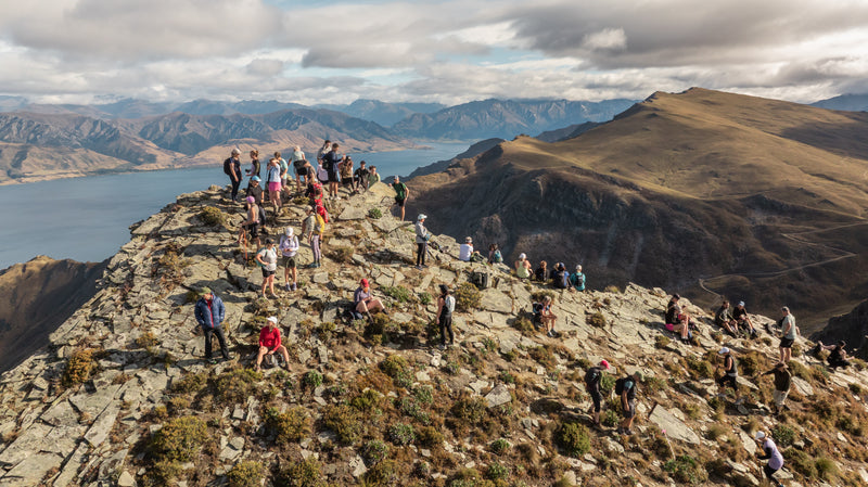 Drone shot of competitors at the top of Breast Peak at the Hike for a Cure event at Lake Hawea Station.