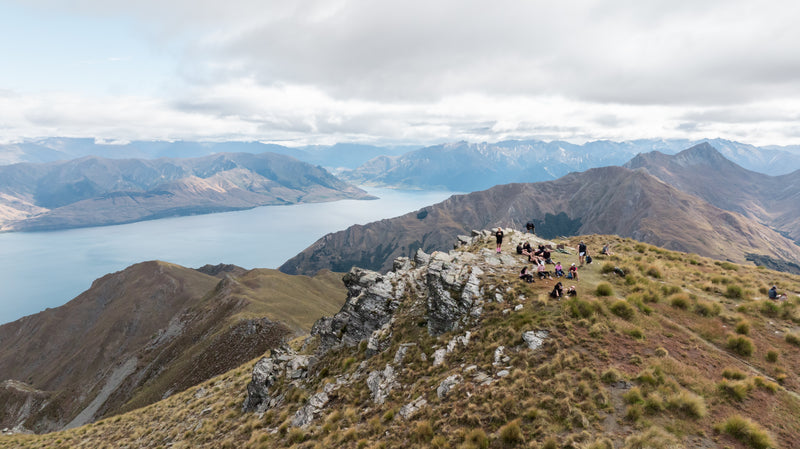 Drone shot of competitors at the top of Breast Peak at the Hike for a Cure event at Lake Hawea Station.