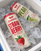 Sodakick Strawberry and Pear on ice in a cooler