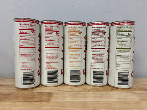 The backs of the five sample cans, with their Nutrition Facts panels and barcodes