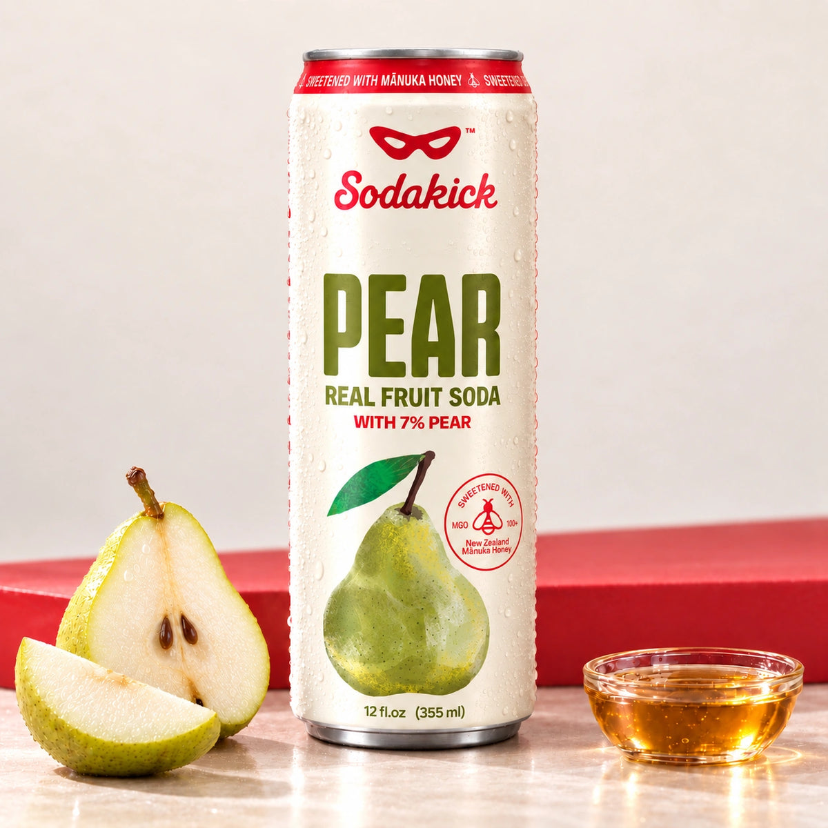 Sodakick Pear can with fresh pears and a small bowl of honey