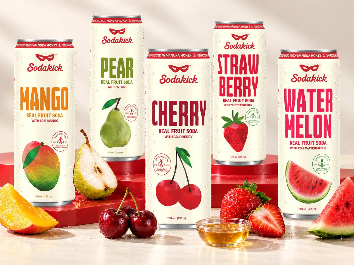 Sodakick cans in Mango, Pear, Cherry, Strawberry and Watermelon with fresh fruit and a bowl of honey